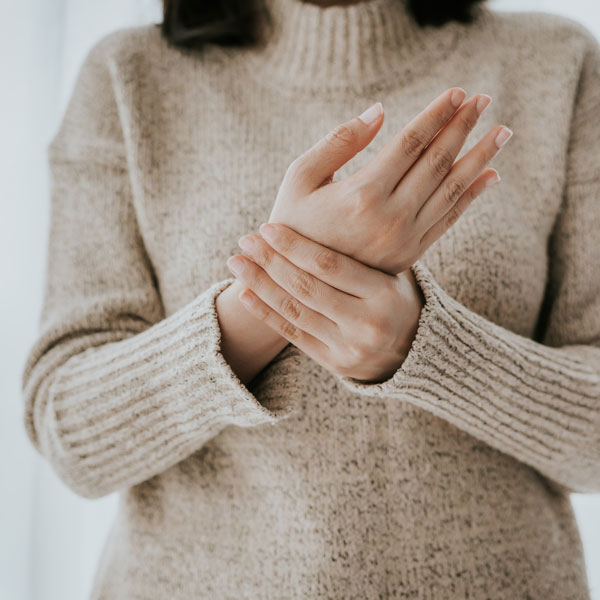 woman feeling wrist with carpal tunnel