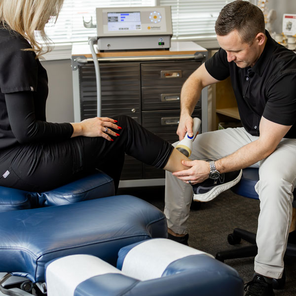 Dr Schulke performing SoftWave treatment on patient