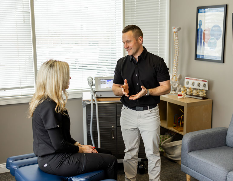 Dr Schulke explaining chiropractics to patient